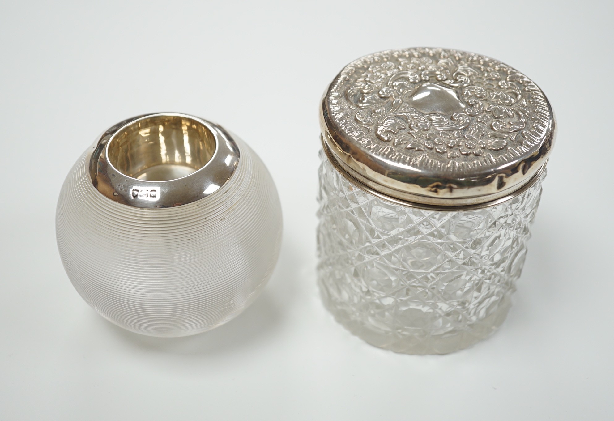 An early 20th century silver mounted ribbed glass match tidy, marks rubbed, height 70mm and a toilet jar